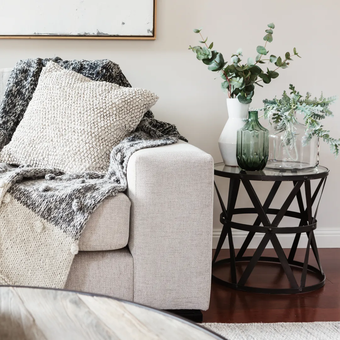Calm grey sofa with eucalyptus styling in a serene interior